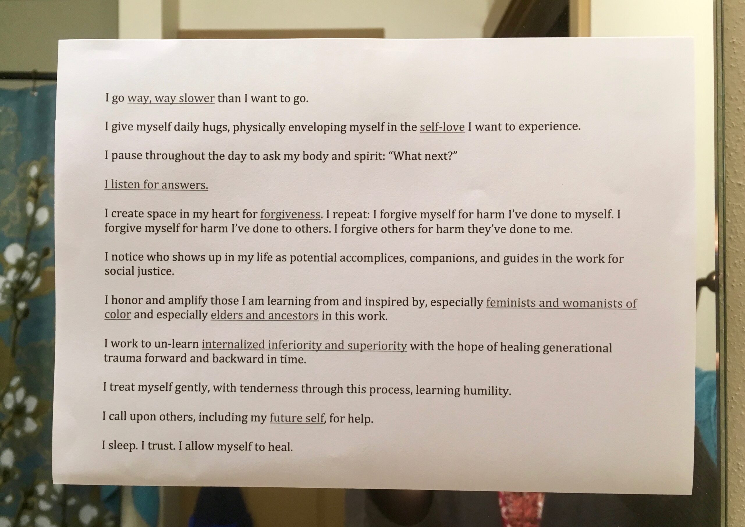 An image of piece of paper taped to a mirror that starts to read "I go way, way slower..."