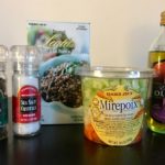 This image shows all the ingredients for the lentil not-soup recipe. From left to right: black pepper, sea salt, steamed lentils, Mirepoix mix, and olive oil.