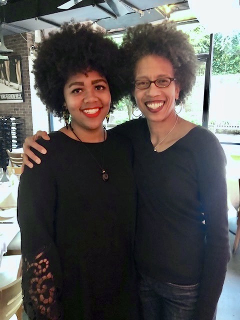 Photo shows Traci Higgins (right) and Alexa Eason (left), standing shoulder-to-shoulder, both dressed in black.