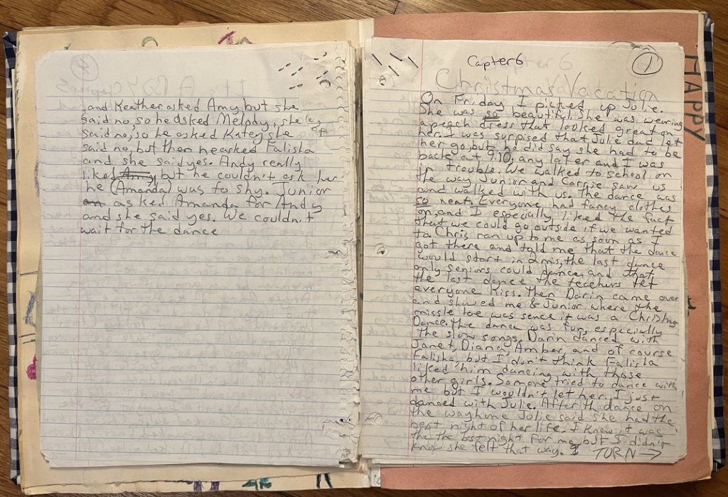 A collection of stapled pages of a book that Beth wrote as a child. The pages are covered in handwriting and the title "Christmas Vacation" can be read at the top of the righthand page.
