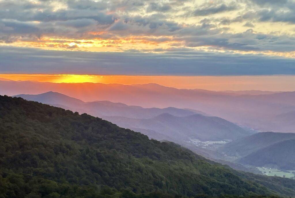 Sunset from the Blue Ridge Parkway, looking across mountains fading green to blue—a view that reminds me of support from all directions.